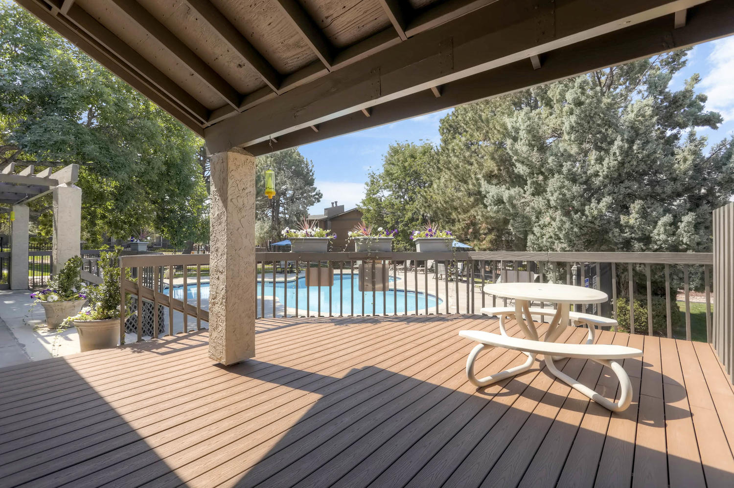The Community Outdoor Deck and Swimming Pool at Greentree Village Apartments