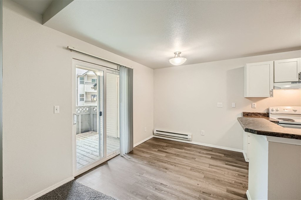 Dining Room leading to Patio/Balcony at Bellwether Apartments in Olympia, Washington
