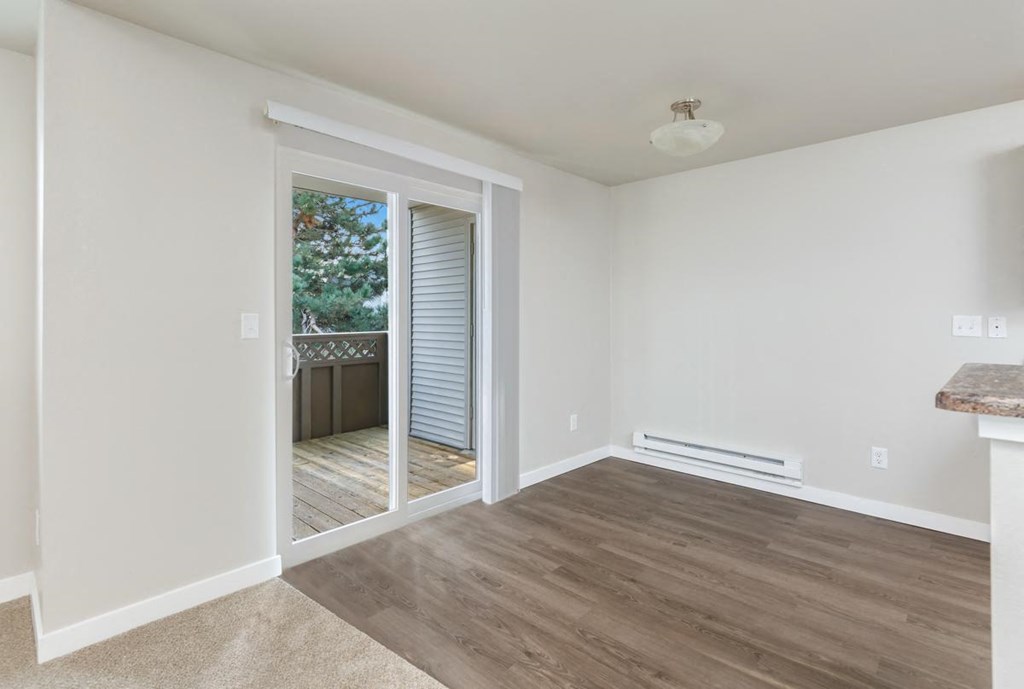 A room with a door leading outside.