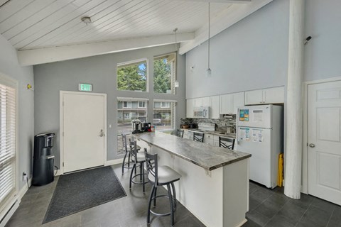 a kitchen with a counter top and a refrigerator