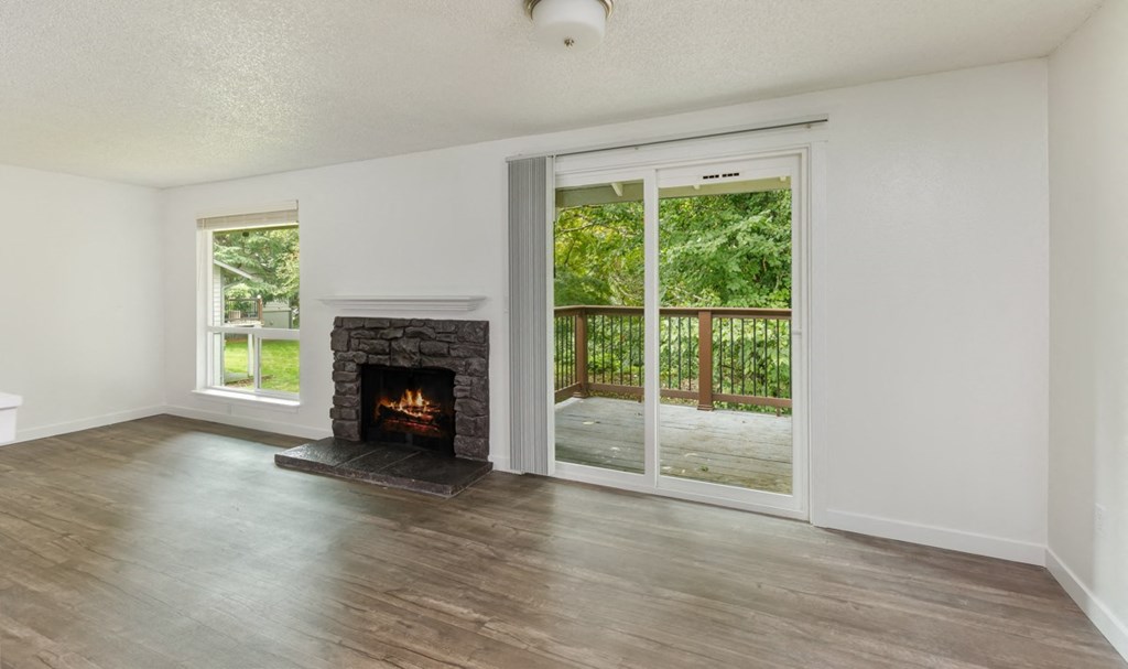 Our Apartment Fireplace with Balcony at Wilderness West Apartments in Olympia, Washington