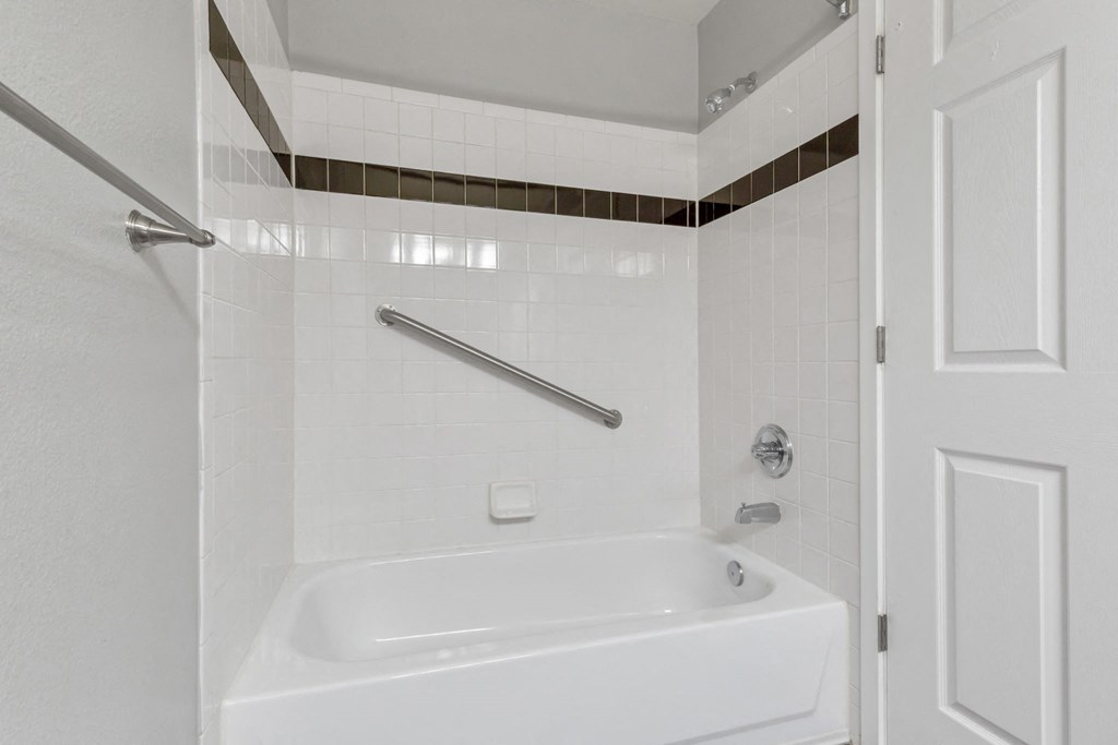 A Bathroom Tub/Shower at The Buttes Apartments, Loveland, CO