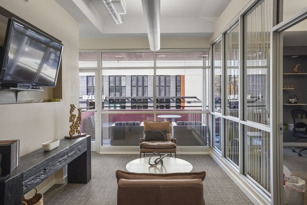 Our Apartment Building Interior Lobby overlooking the Common Area Patio at Sleek Lofts Apartments in Denver, Colorado