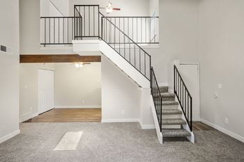 a staircase in a home with carpeted stairs  at Hilltop View in Denver, CO