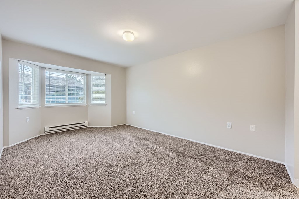 Primary bedroom in a two-bedroom two-bath apartment at Capitol City in Lacey, WA