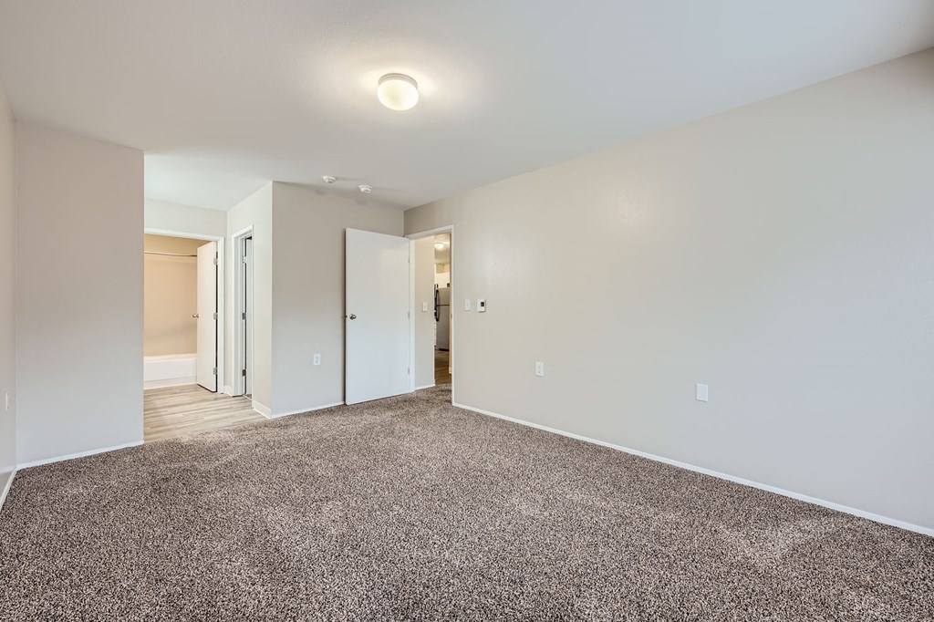 Primary bedroom in a two-bedroom two-bath apartment at Capitol City in Lacey, WA