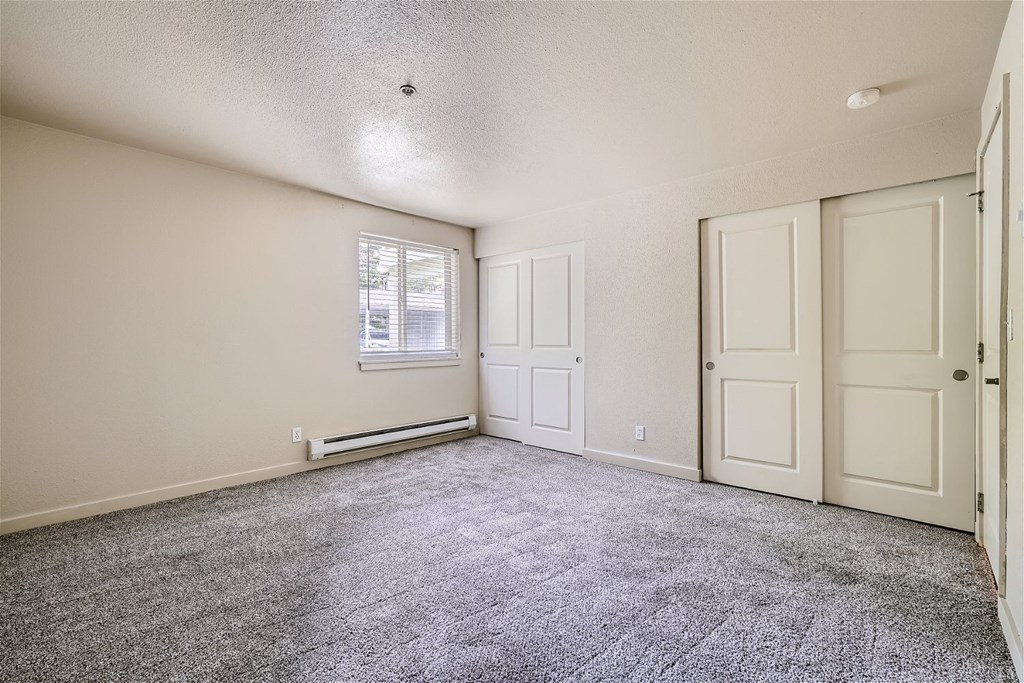 A Renovated Bedroom with Closets at Ladera Apartments