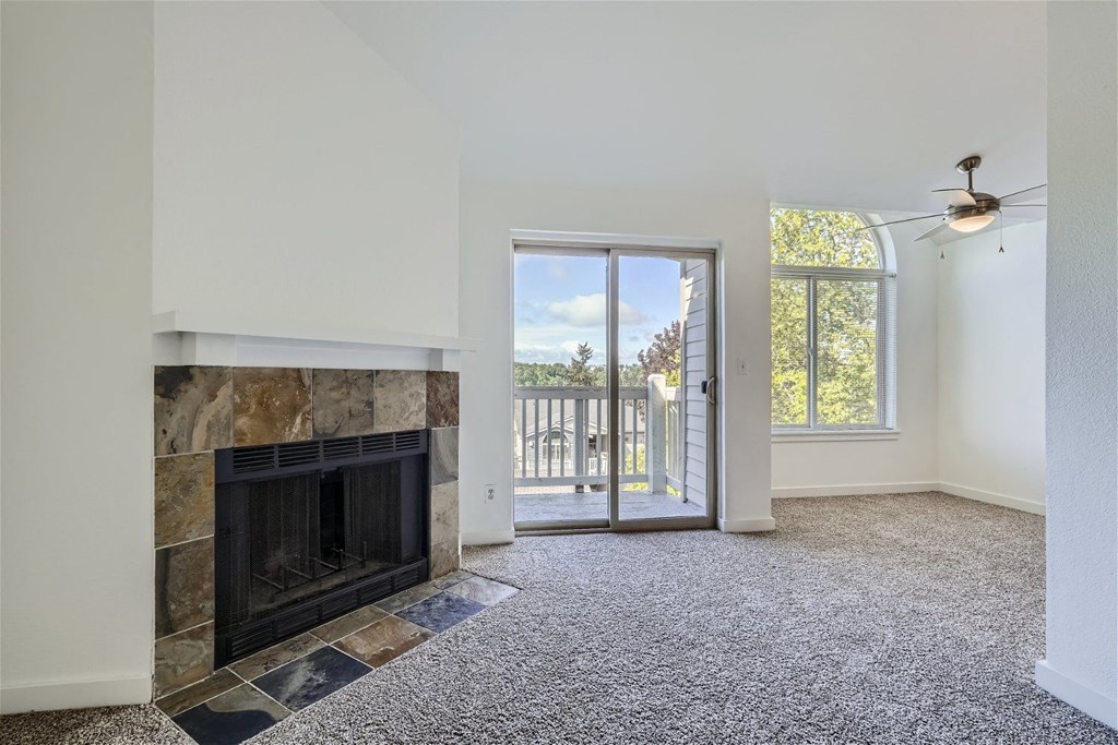 A Renovated Living Room with a Fireplace at Ladera Apartments