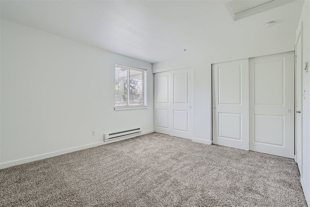 A Renovated Bedroom with Closets at Ladera Apartments