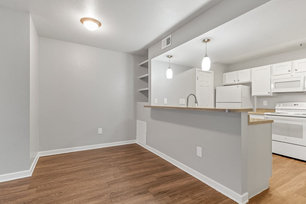 A Dining Room and Kitchen at The Buttes Apartments, Loveland