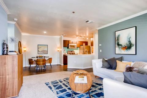 A Living Room and Kitchen at Eagles Landing at Church Ranch Apartments