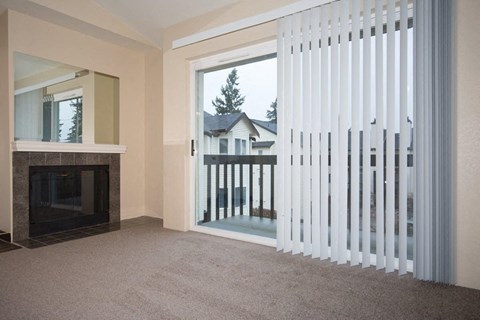 A Renovated 1 Bedroom 1 Bath Living Room with Fireplace at Brookhaven Apartments in Federal Way, Washington