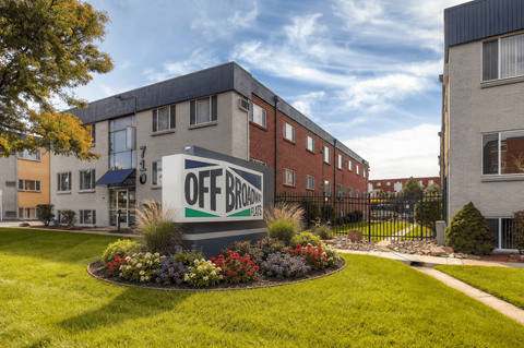 A building with a sign that says "OFF BROWN" in front of it.