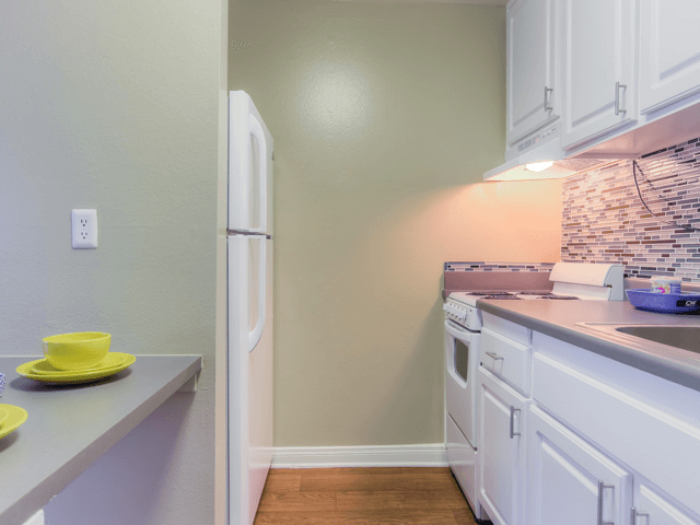 Fully equipped kitchen at Twenty 2 Eleven Apartment Homes, Canoga Park, CA