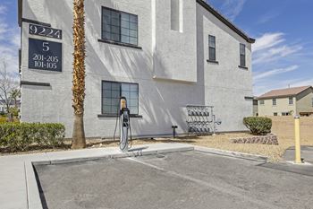 a gas pump in front of a white building