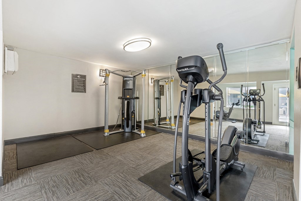 Transform your workout routine in our newly remodeled gym, where sleek glass walls offer inspiring views as you break a sweat with our state-of-the-art weights and cardio equipment.