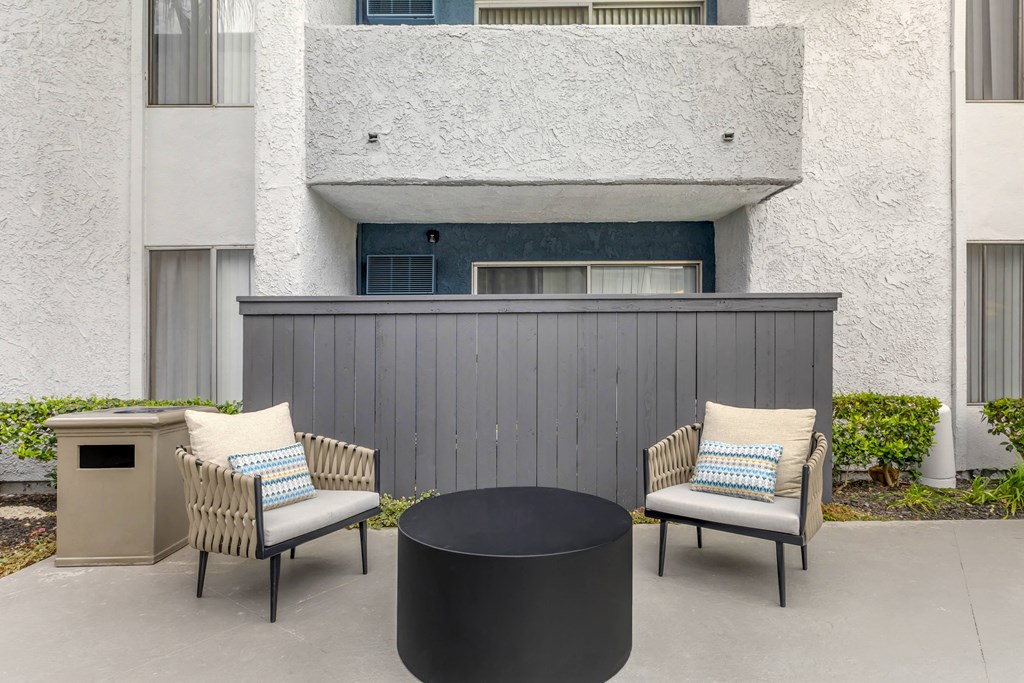 Relaxation awaits: Unwind poolside at Cornerstone Apartments with your own private patio oasis. Dive into serenity and soak up the sun in style.