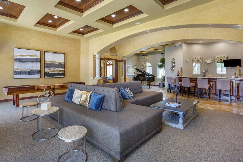 Elegant clubhouse with coffered ceilings and a piano ambiance