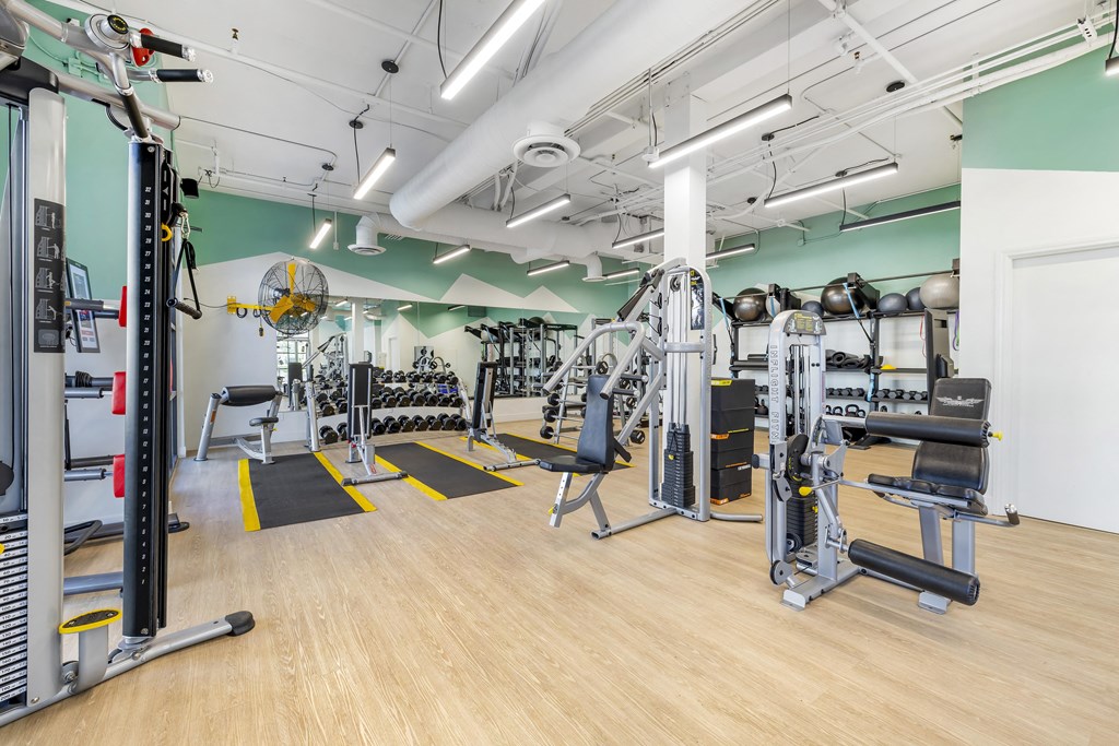 Full-length mirrors line the walls, allowing for perfect form checks and boosting confidence as you work toward your goals.