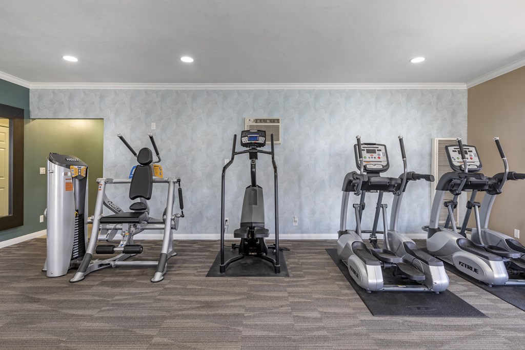 a gym with treadmills and elliptical machines at Sage Creek Apartment Homes, Simi Valley