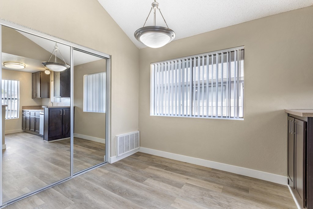 Reflecting modern comfort and style: where the dining room mirror echoes the elegance of our updated kitchens at Independence Plaza.