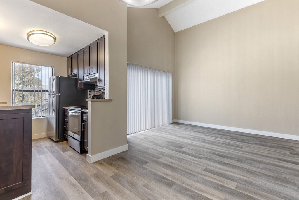 njoy the seamless flow of this stunning apartment, where a fully-equipped kitchen with sleek stainless steel appliances effortlessly connects to the dining room and expansive living space.