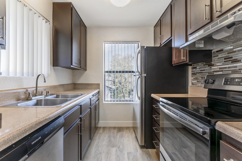 Modern luxury meets comfort at Independence Plaza, where every home boasts a sleek, fully equipped kitchen featuring stainless steel appliances.