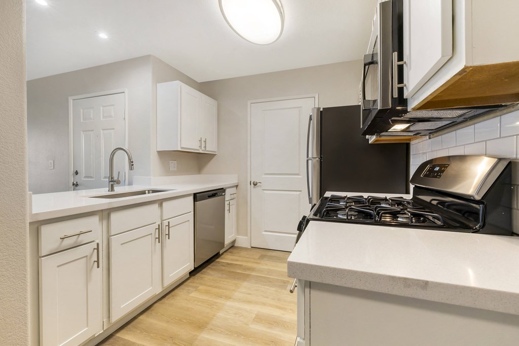 Spacious living room with a kitchen and sliding glass doors