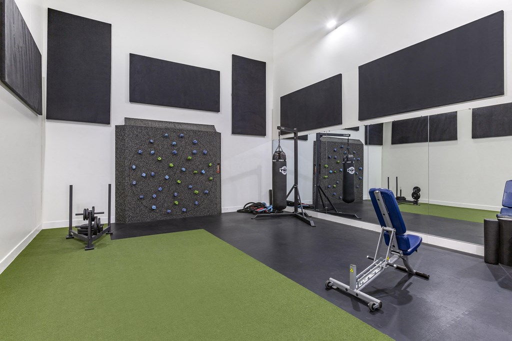 Experience our state-of-the-art gym featuring a dynamic climbing wall and exercise equipment at Boulders at Lookout Mountain Apartment Homes, Phoenix, 85022