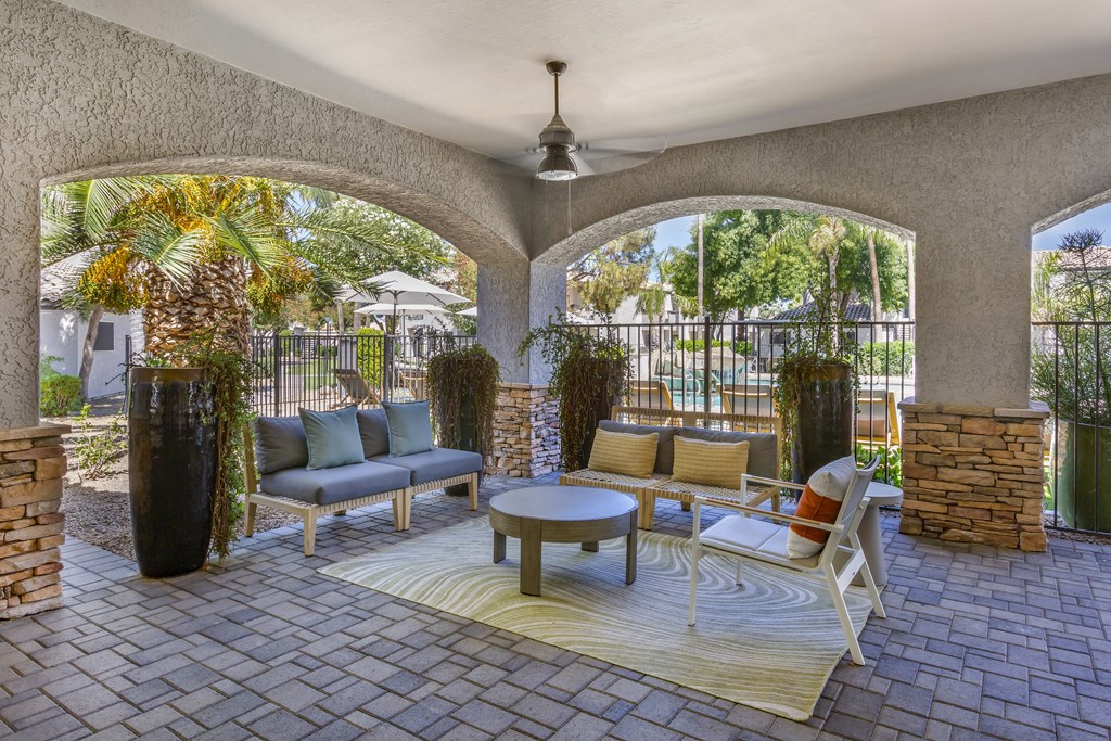 Lounge poolside in comfort with our stylish outdoor seating at Boulders at Lookout Mountain Apartment Homes, Arizona