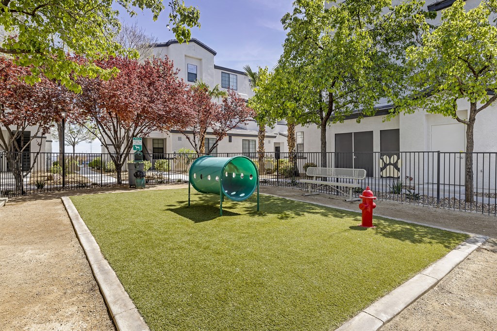 Unleash the ultimate in pet-friendly luxury at The Michael B! Our gated dog park offers a serene retreat with shaded trees and a cozy bench for you and your furry friend to relax and enjoy the day.at