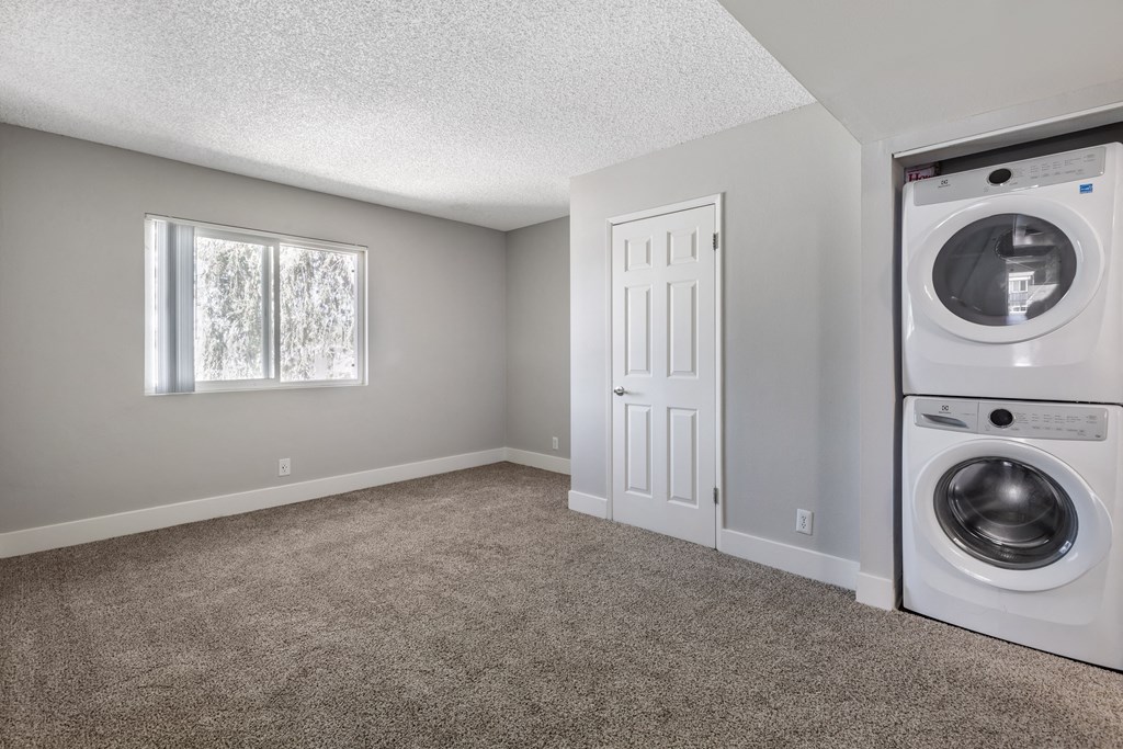 an empty laundry room with a washer and dryer at Sage Creek Apartment Homes, Simi Valley, CA 93063