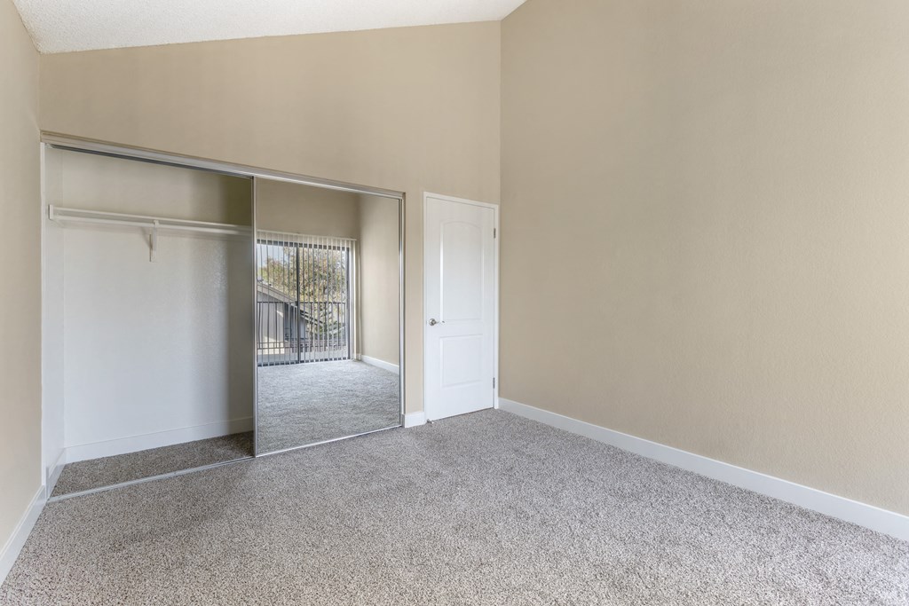 Your sanctuary awaits behind mirrored doors, where every detail, from plush carpeting to spacious closets, promises a haven of tranquility.