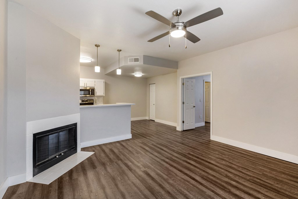 Experience cozy comfort in our lounge featuring a welcoming fireplace at Boulders at Lookout Mountain Apartment Homes, Phoenix