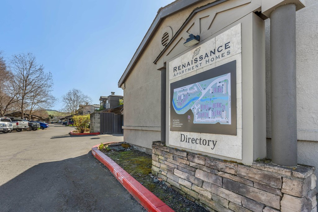 a building with a directory sign on the side of it
