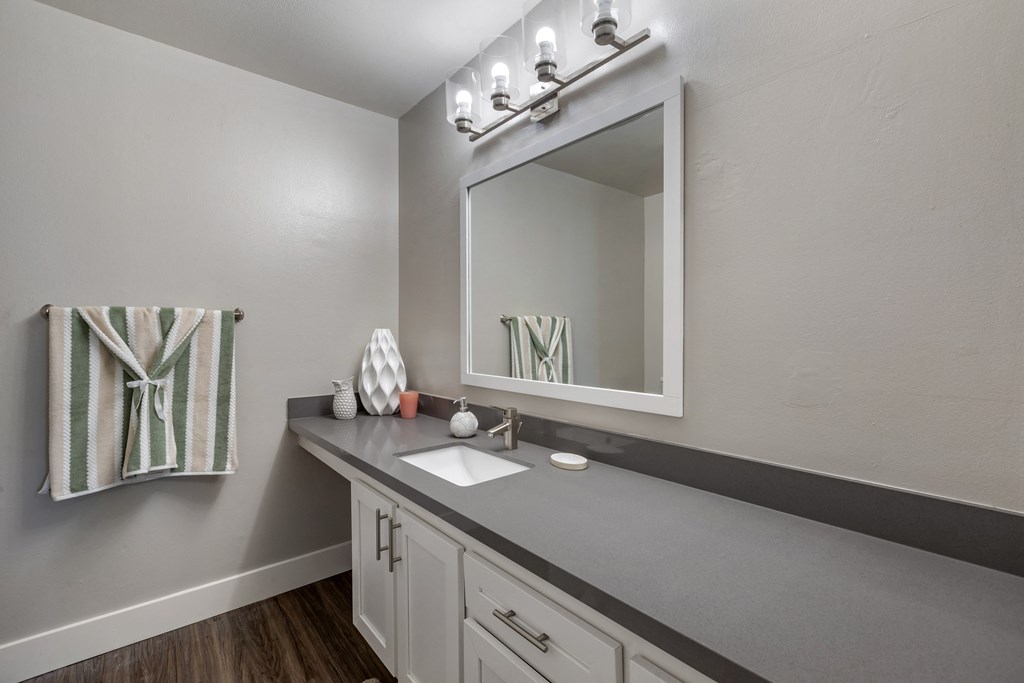 an empty bathroom with a mirror and a sink at Sage Creek Apartment Homes, California, 93063