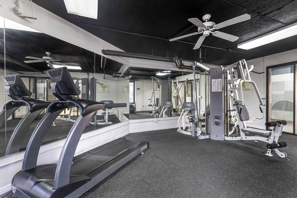 Sweat it out under the cool breeze: Our gym at Independence Plaza keeps you motivated with weights and a refreshing ceiling fan. Your fitness journey starts here!