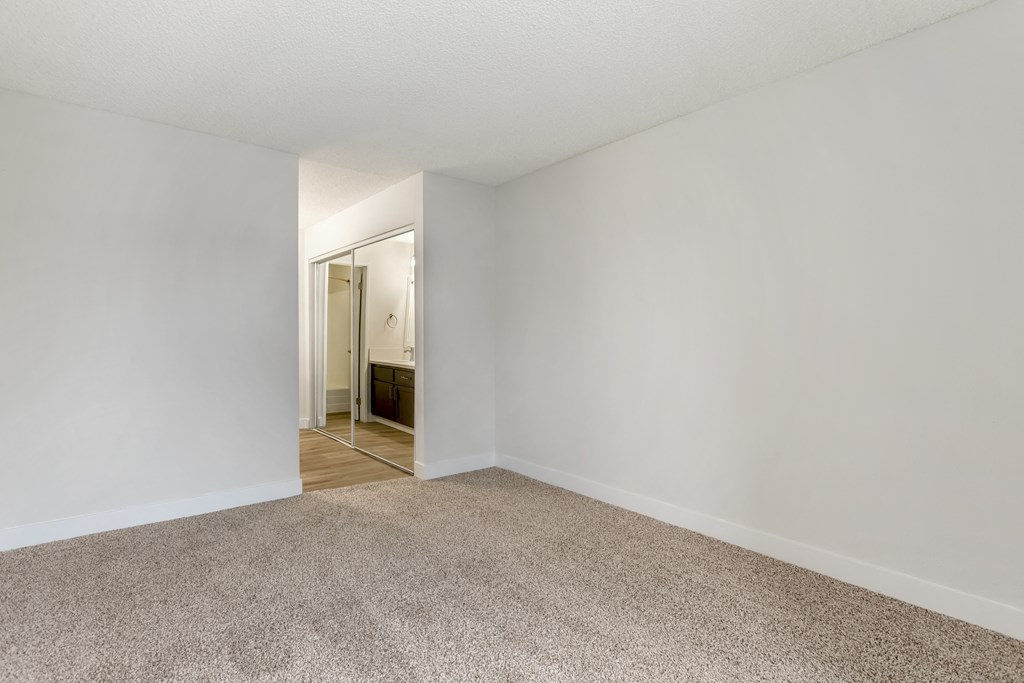 Modern comfort meets timeless elegance. Step into serenity with our updated bedrooms, featuring pristine white walls and plush new carpeting.