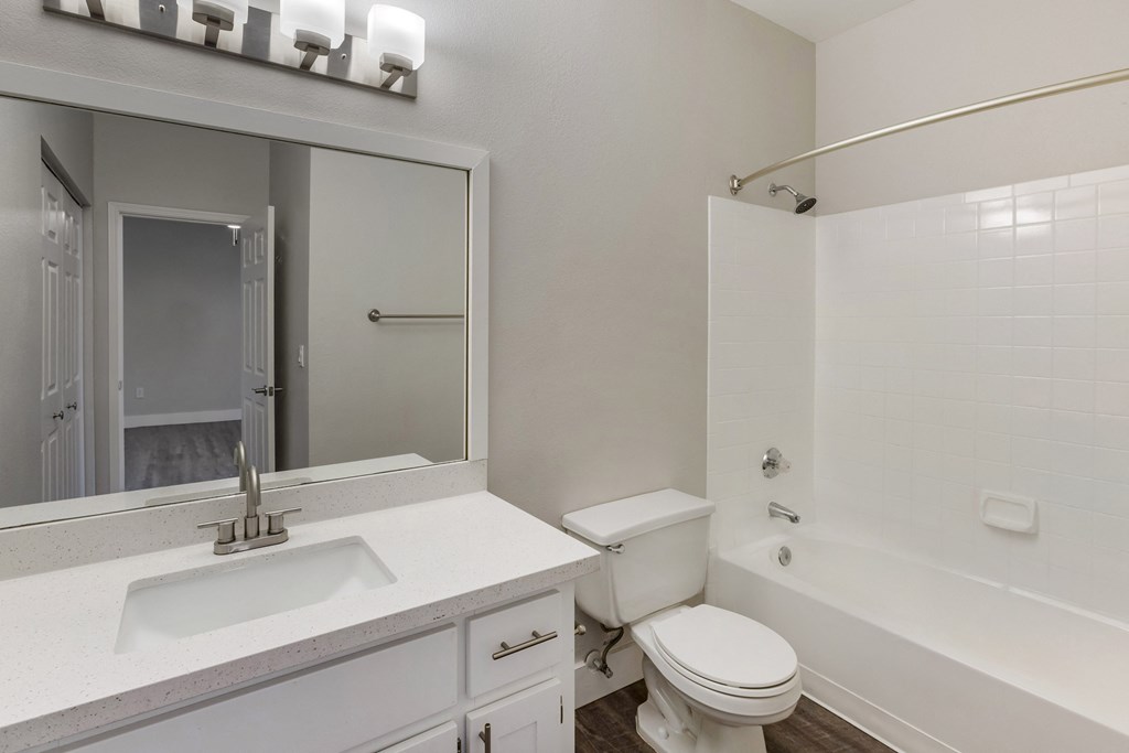 Experience luxury with our bathroom boasting a comfortable bathtub for your relaxation at Boulders at Lookout Mountain Apartment Homes, Phoenix Arizona