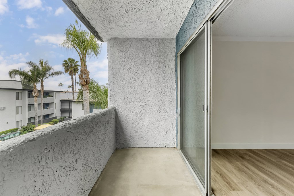 Step into serenity with our Cornerstone Apartments - where every balcony offers a gateway to tranquil palm-lined patios, perfect for embracing the outdoors right at home.