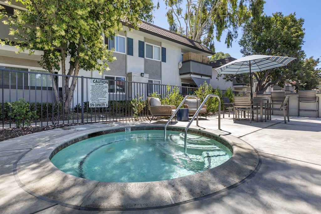 A hot tub is offered at the pool encloser.at Sage Creek Apartment Homes, Simi Valley, 93063