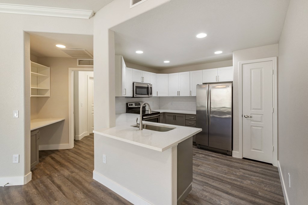A modern kitchen featuring stainless steel appliances at Trevi Apartment Homes, Chandler