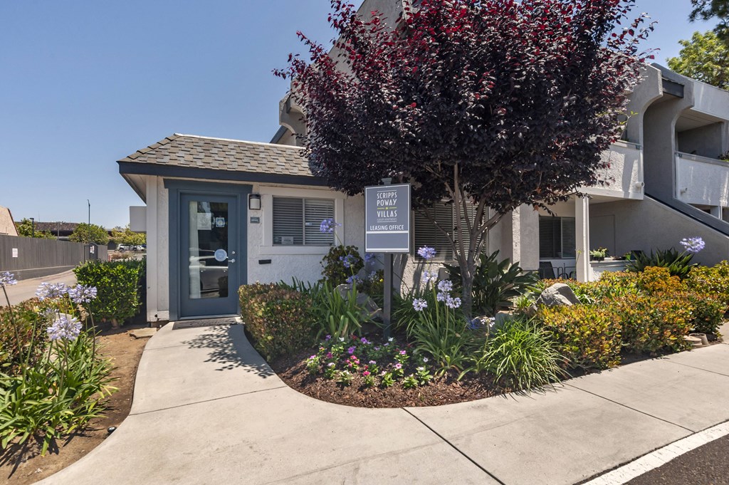 a small white building with a tree in front of it at Scripps Poway Villas, California, 92064