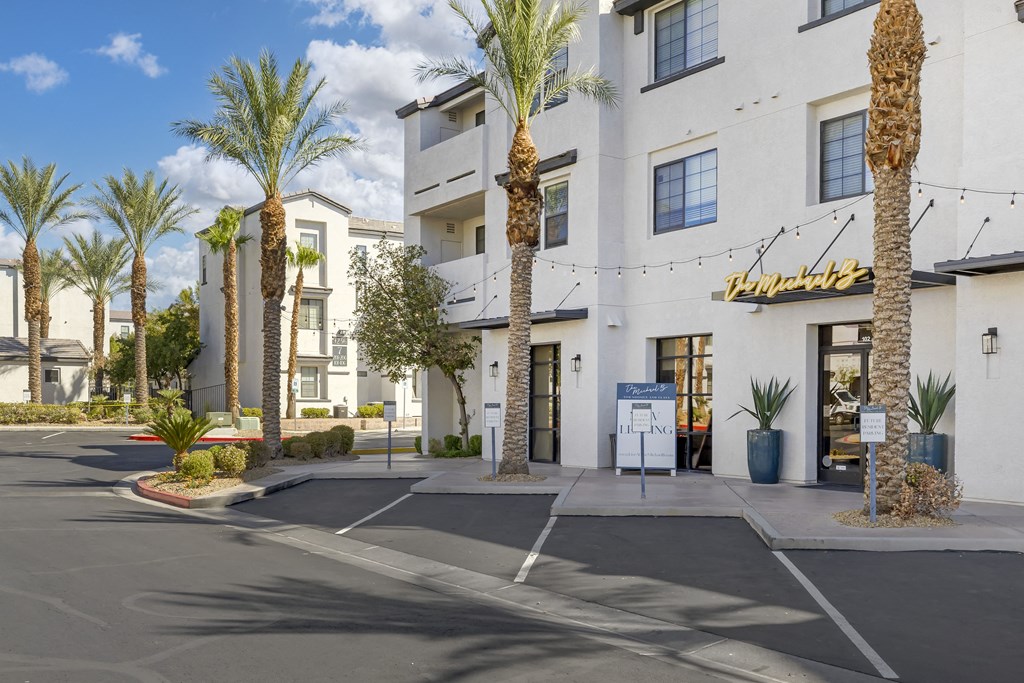 Tall, graceful palm trees line the pathway, adding a touch of tropical elegance to the space.