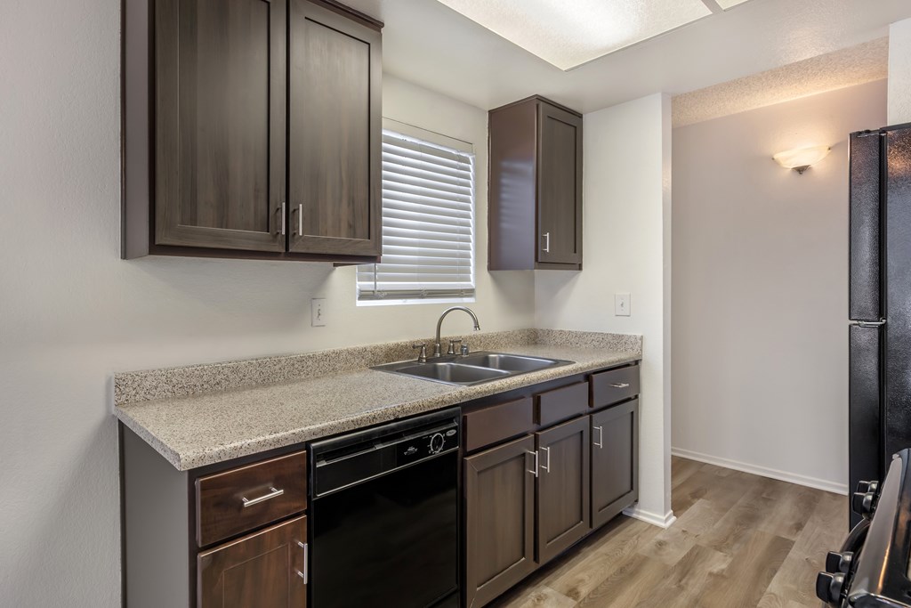 Sedona Apartments in Moreno Valley offers renovated units with sleek black appliances and modern chocolate-colored cabinets for stylish, comfortable living.