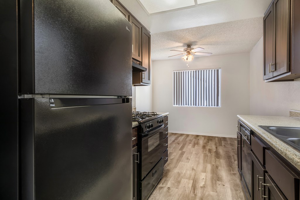 Sedona Apartments in Moreno Valley offers renovated units with updated flooring, sleek black appliances, modern cabinets, and stylish ceiling fans.