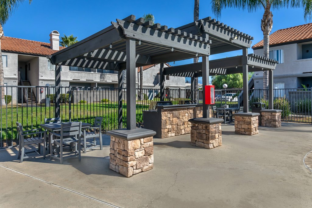 Sedona Apartments in Moreno Valley feature a renovated pool deck and resident gas grills, perfect for relaxing and outdoor cooking.