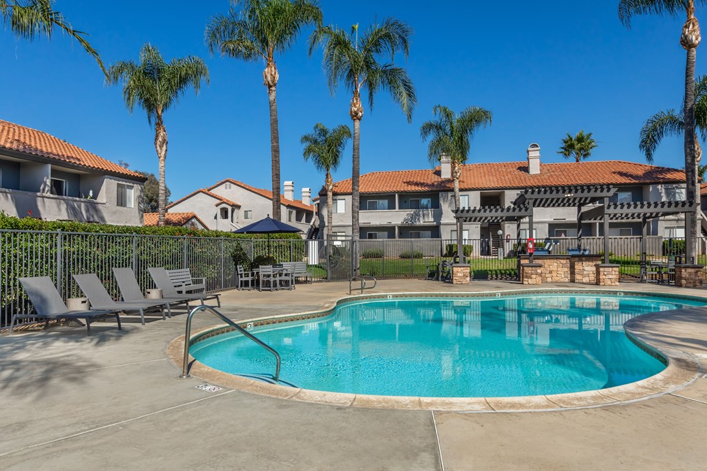 Sedona Apartments in Moreno Valley features a renovated pool deck with stylish lounge chairs—perfect for relaxing and soaking up the sun.