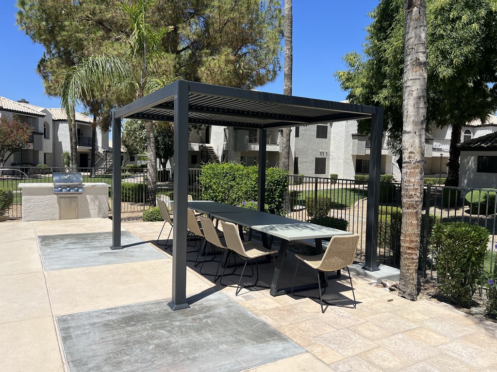 An ideal lounge setting for poolside enjoyment at Boulders at Lookout Mountain Apartment Homes, Arizona, 85022