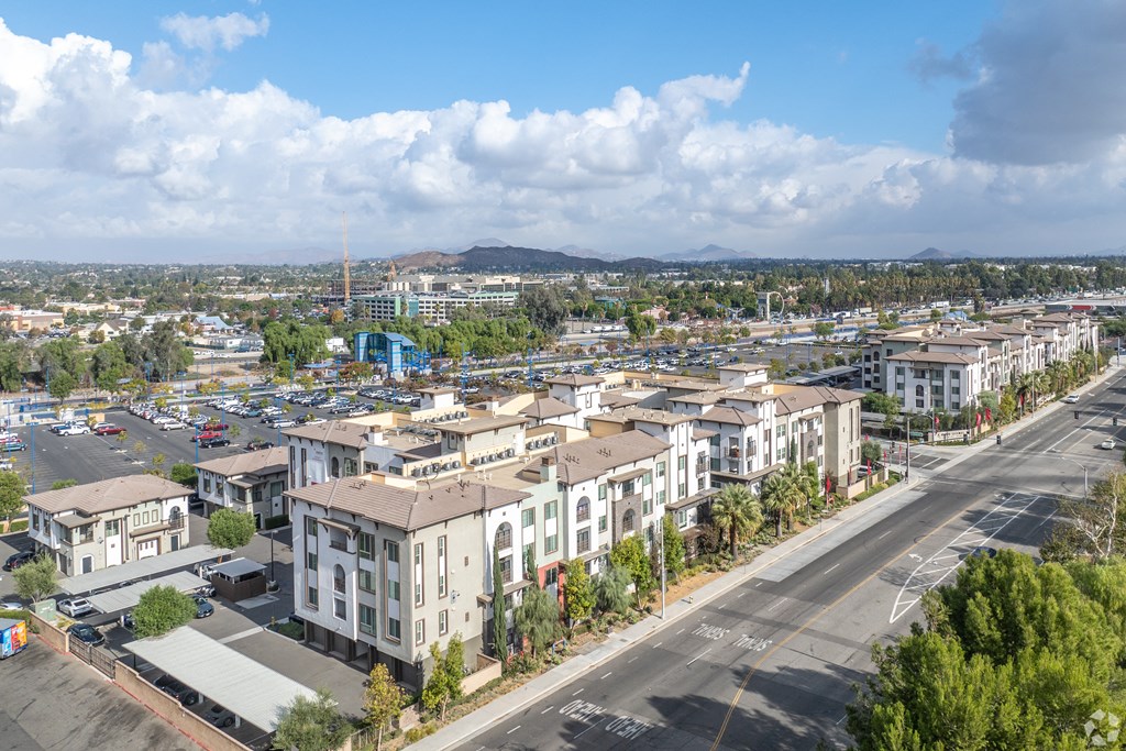 A view of a town with buildings and a road.